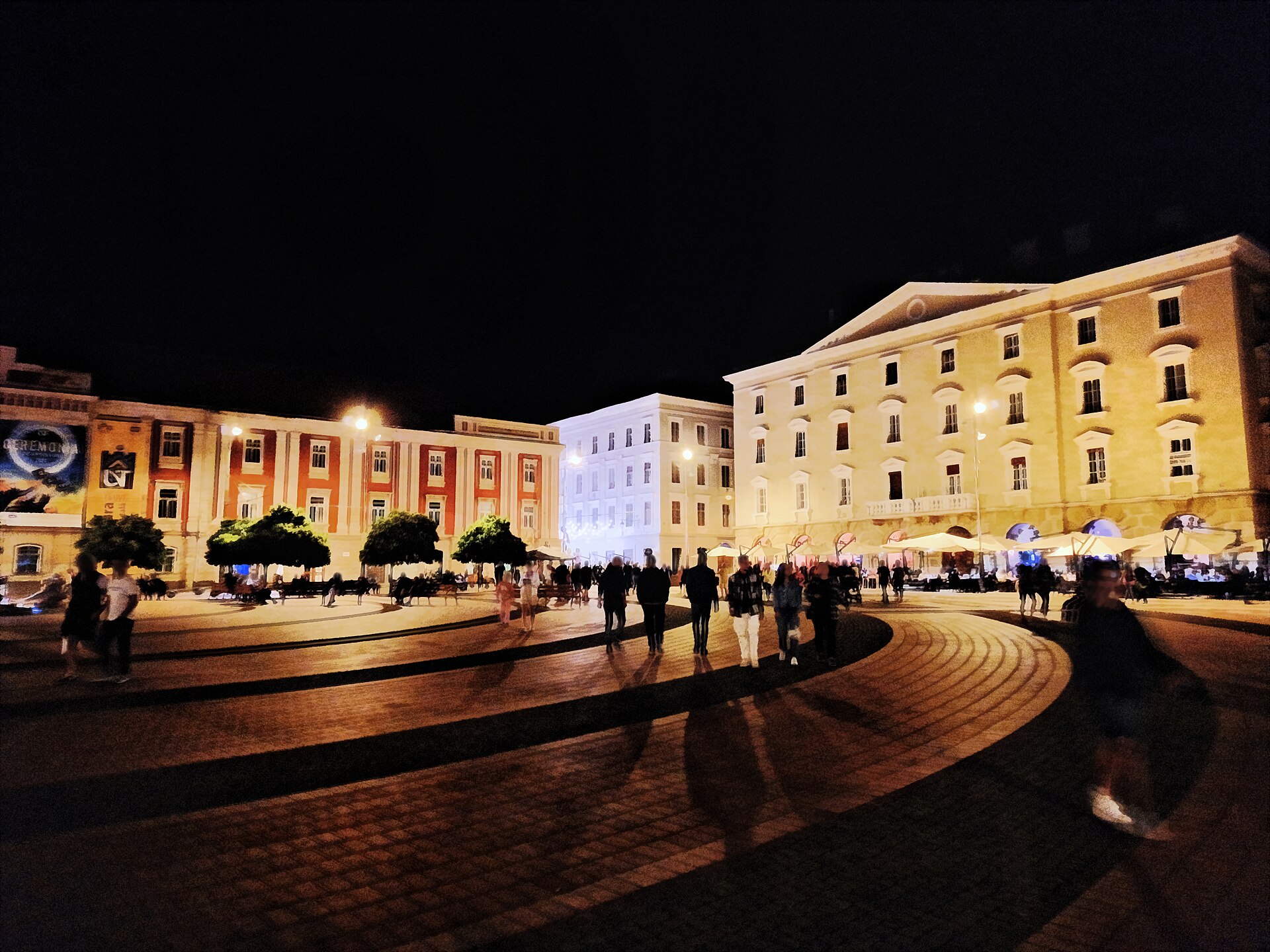 Liberty Square in Timișoara at night, lit by warm street lamps